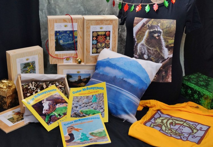 Pictured: Wooden jigsaw puzzles from Artifact Puzzles, Gator McBumpypants picturebooks and T-shirts and pillow cover from Red Bubble