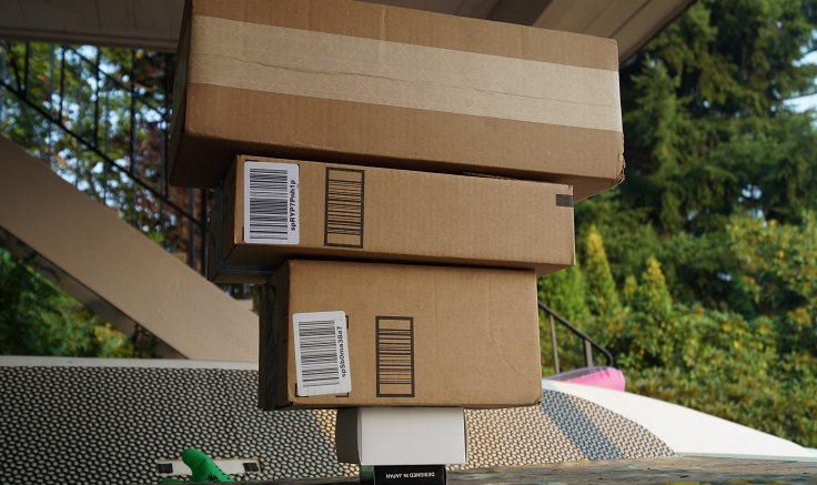 A photograph of large boxes stacked on smaller boxes
