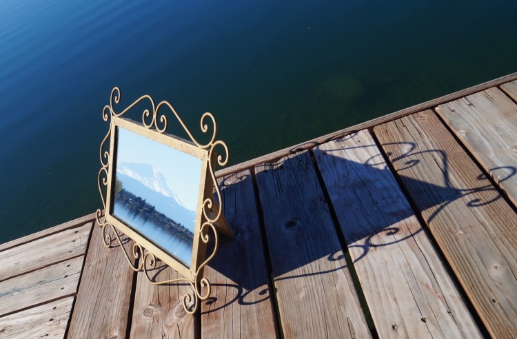 photograph of Mt. Rainier in a mirror on a dock on Lake Tapps